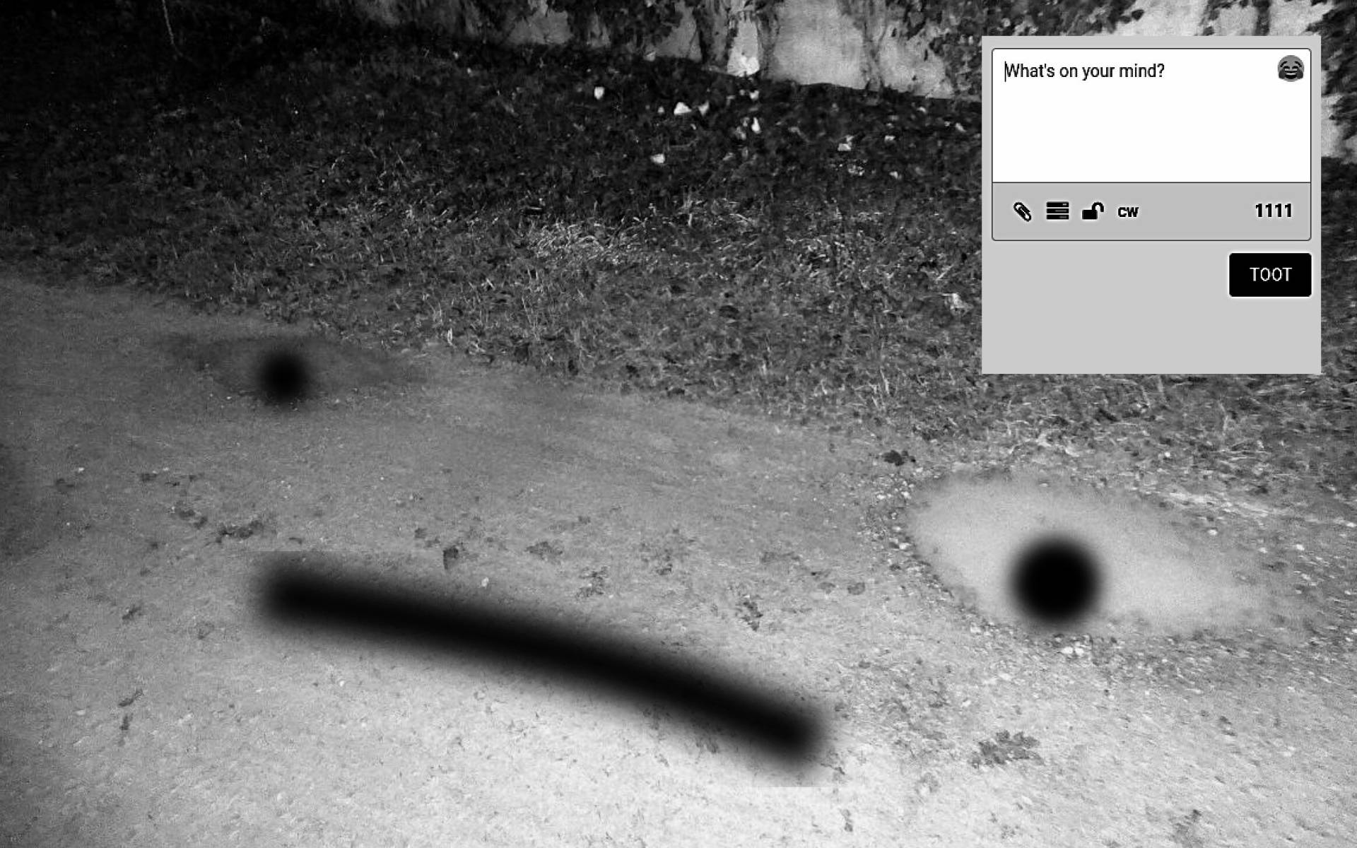 a black and white photograph of two puddles on a small path at night, black spraypaint form two eyes and a mouth, also theres a screenshot of socialmedia entry form asking the question What's on your mind?
