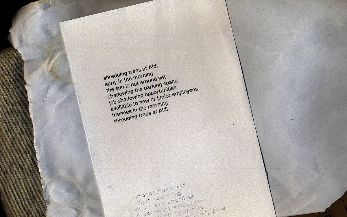 sheet of paper. the poem is printed in a sans serif typeface.